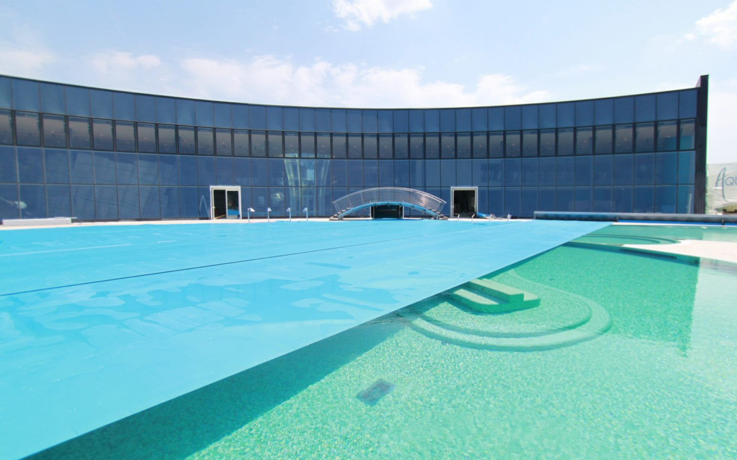 Retractable pool cover reels for public pools